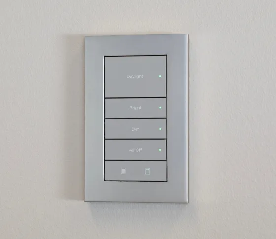 Control4 LUX wired keypad in a light metallic finish with engraved lighting buttons